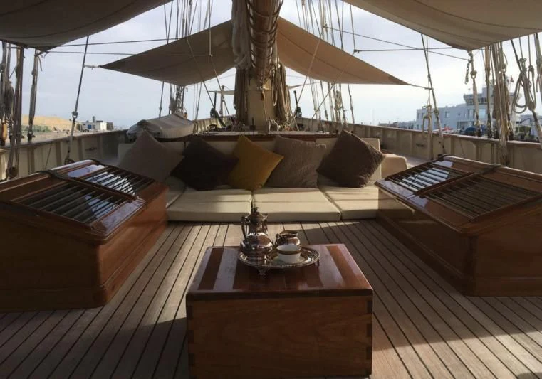 a room with a table and a bed aboard ATLANTIC Yacht for Charter