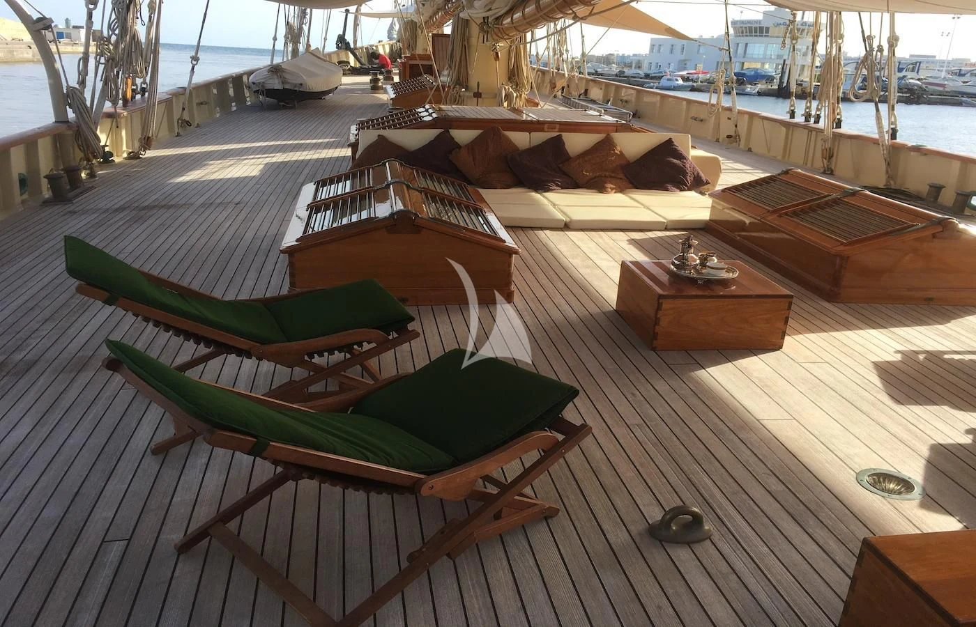 a deck with a deck and a deck with a boat on it aboard ATLANTIC Yacht for Charter