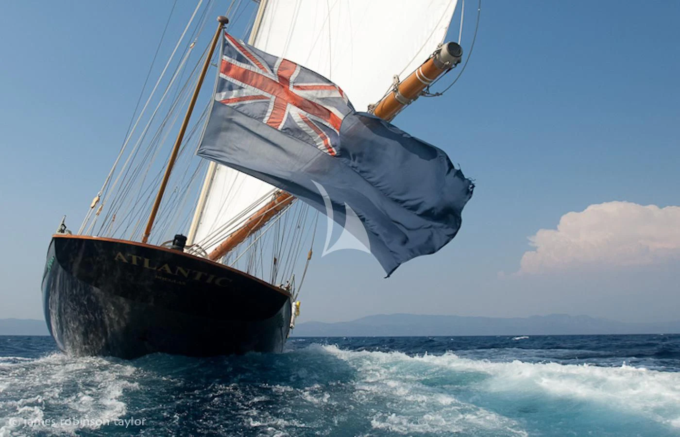 a sailboat on a beach aboard ATLANTIC Yacht for Charter