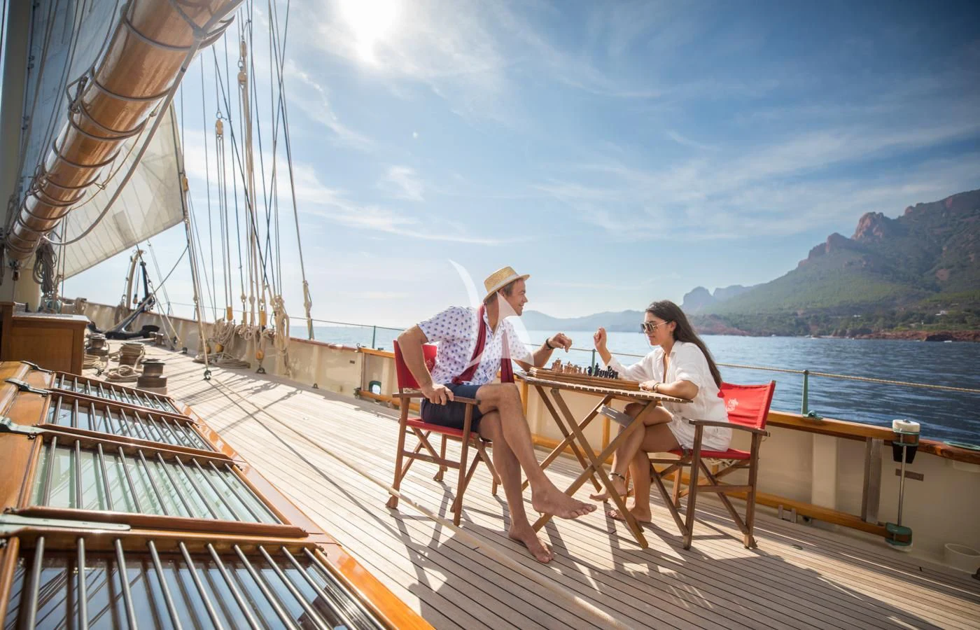 a couple sitting on a boat aboard ATLANTIC Yacht for Charter
