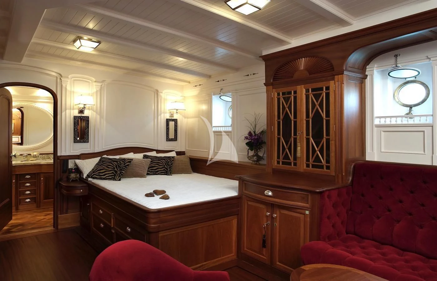 a bedroom with a bed and a couch aboard ATLANTIC Yacht for Charter
