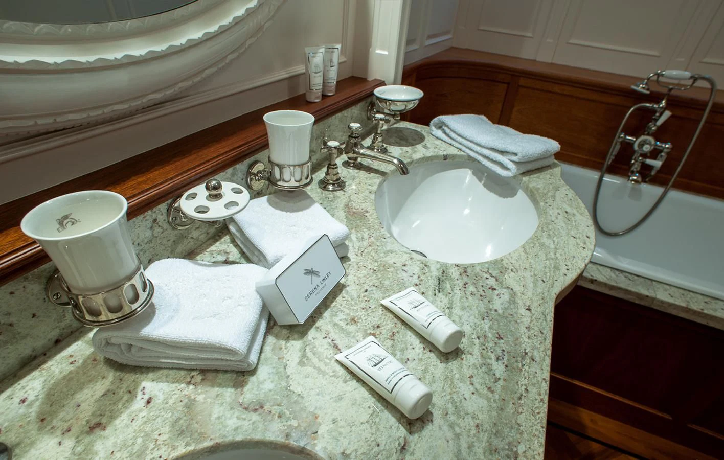 a bathroom counter with a sink and toiletries aboard ATLANTIC Yacht for Charter