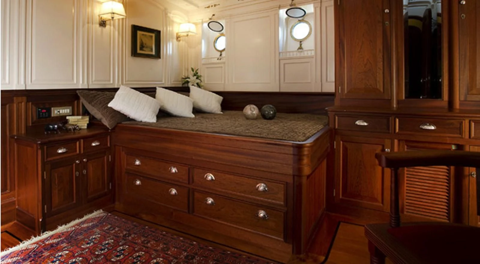 a kitchen with wooden cabinets aboard ATLANTIC Yacht for Charter