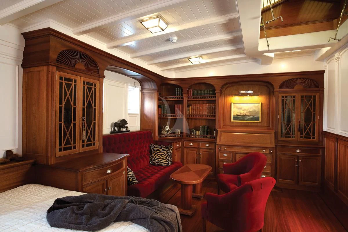 a room with a bed and a desk aboard ATLANTIC Yacht for Charter