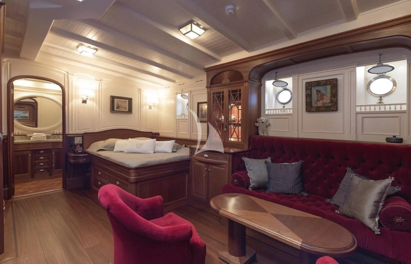 a large bedroom with a bed and a couch aboard ATLANTIC Yacht for Charter
