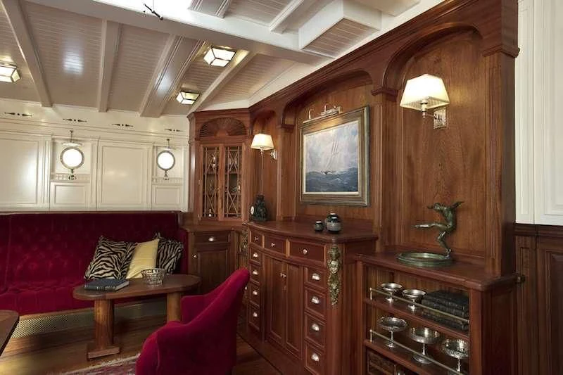 a living room with a large mirror aboard ATLANTIC Yacht for Charter