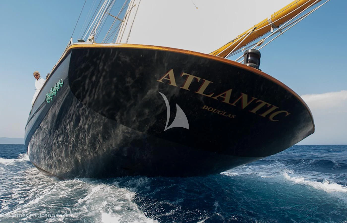 a person standing on a boat aboard ATLANTIC Yacht for Charter