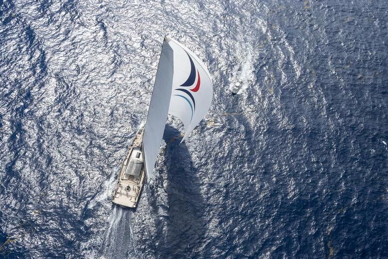 a white and black boat in the water aboard NILAYA Yacht for Sale