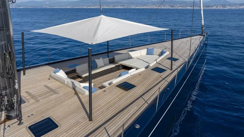 a deck with a large white umbrella aboard NILAYA Yacht for Sale