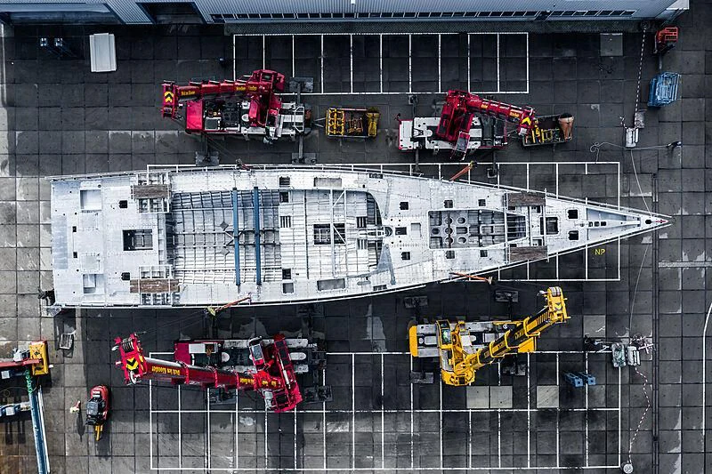 a large building with a lot of windows and a few cranes aboard NILAYA Yacht for Sale