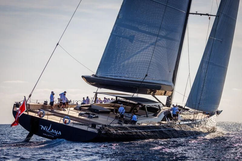 a sailboat with people on it aboard NILAYA Yacht for Sale