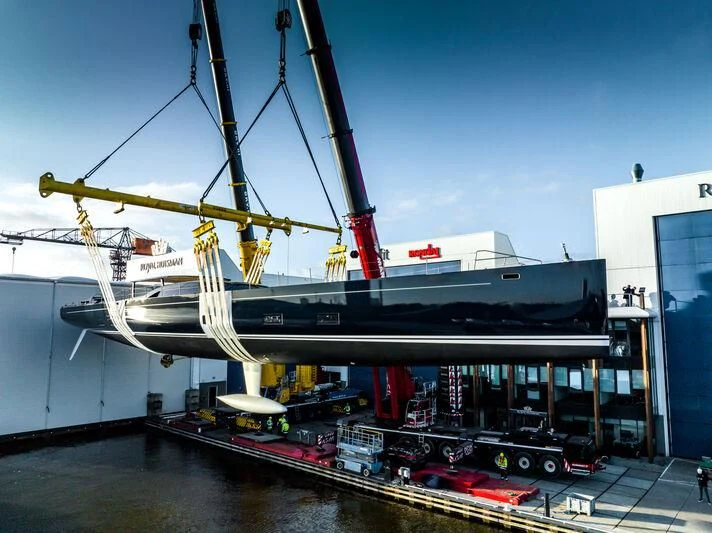a large white ship docked aboard NILAYA Yacht for Sale