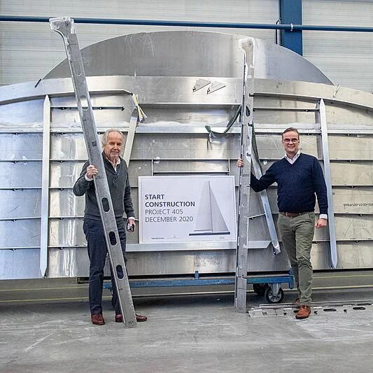 men standing next to a large metal structure aboard NILAYA Yacht for Sale