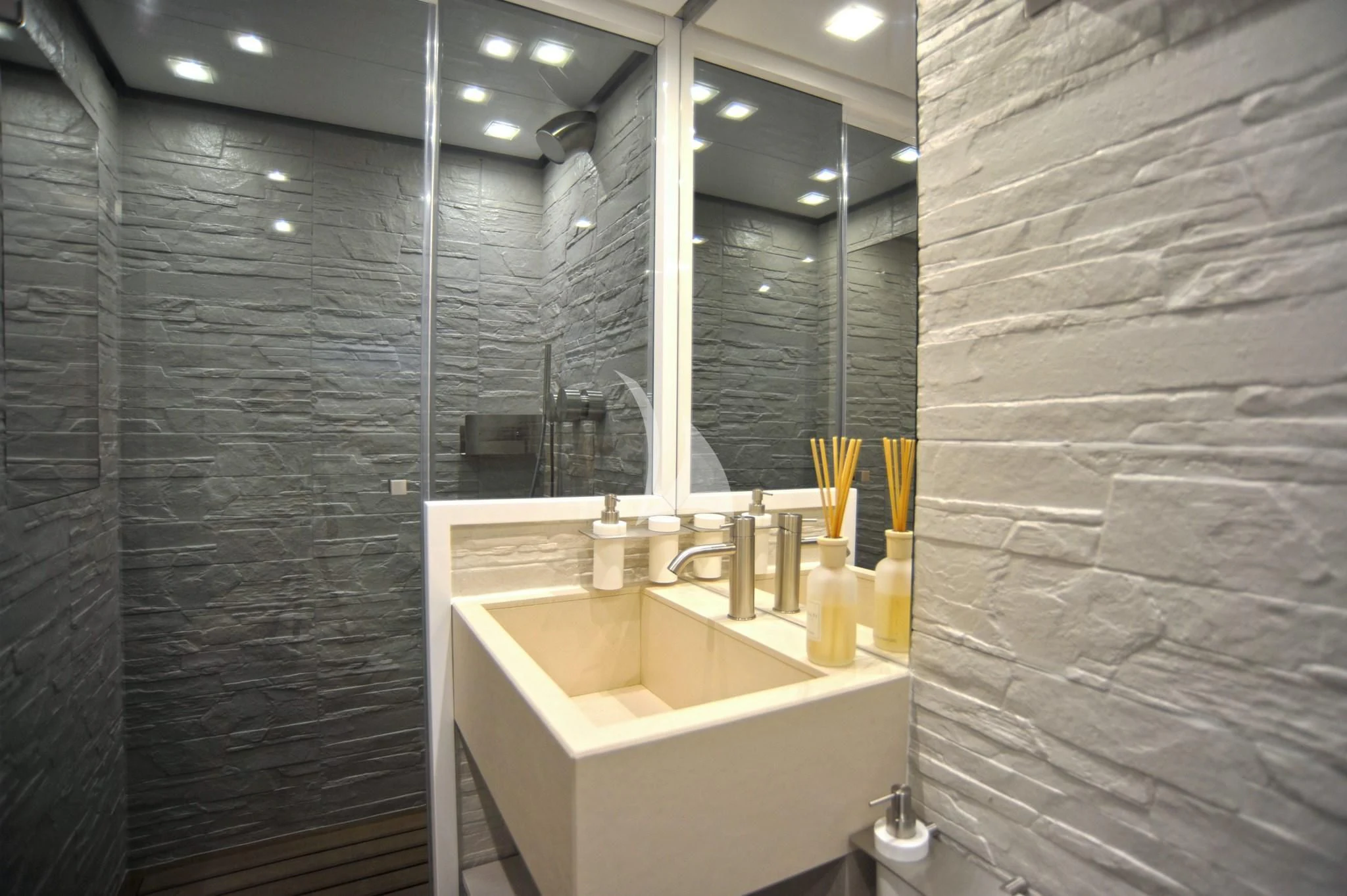 a bathroom with a sink and shower aboard IROCK Yacht for Sale