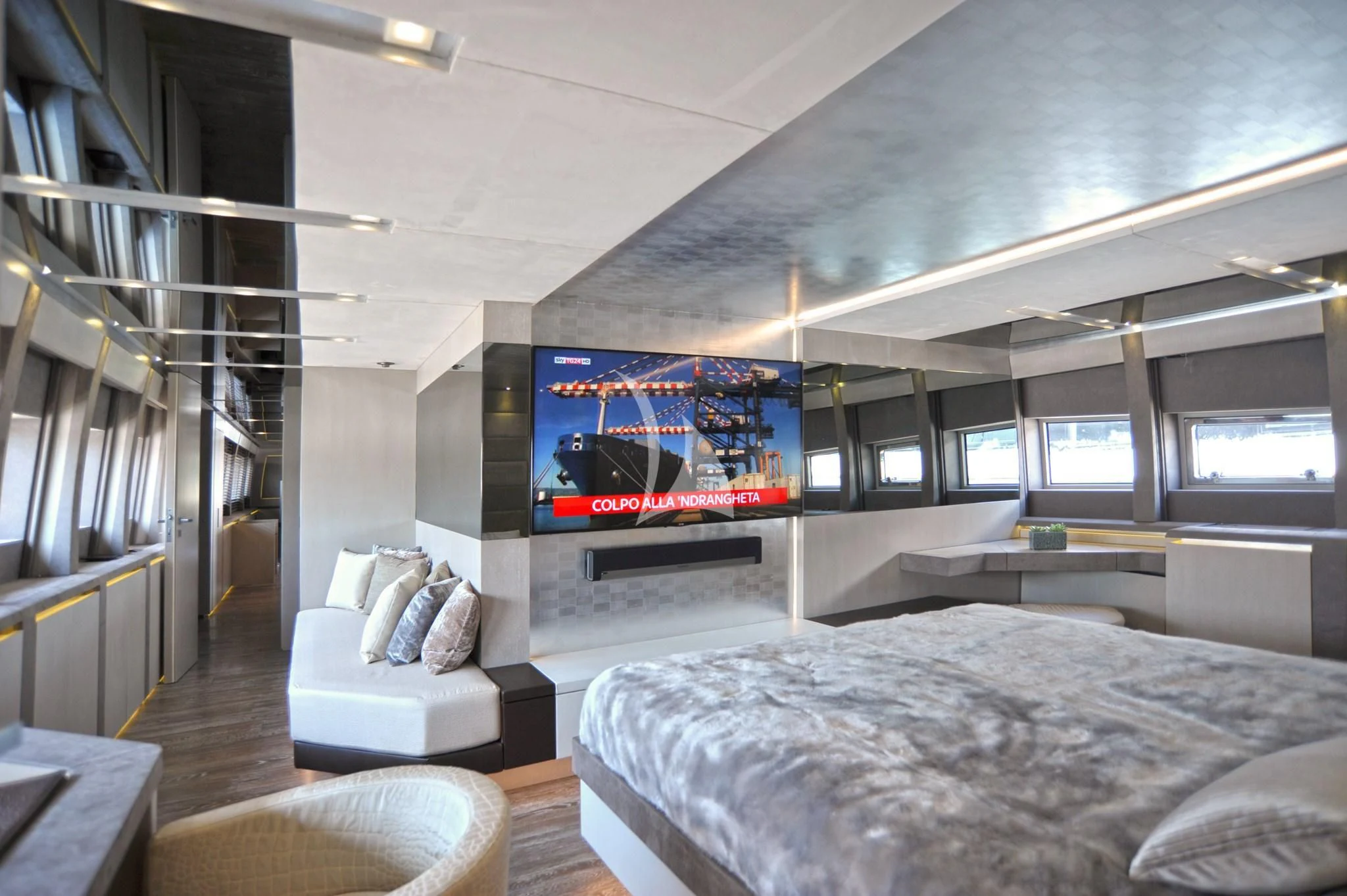 a room with a bed and a tv aboard IROCK Yacht for Sale