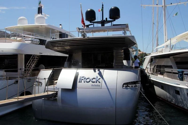 a boat docked at a pier aboard IROCK Yacht for Sale
