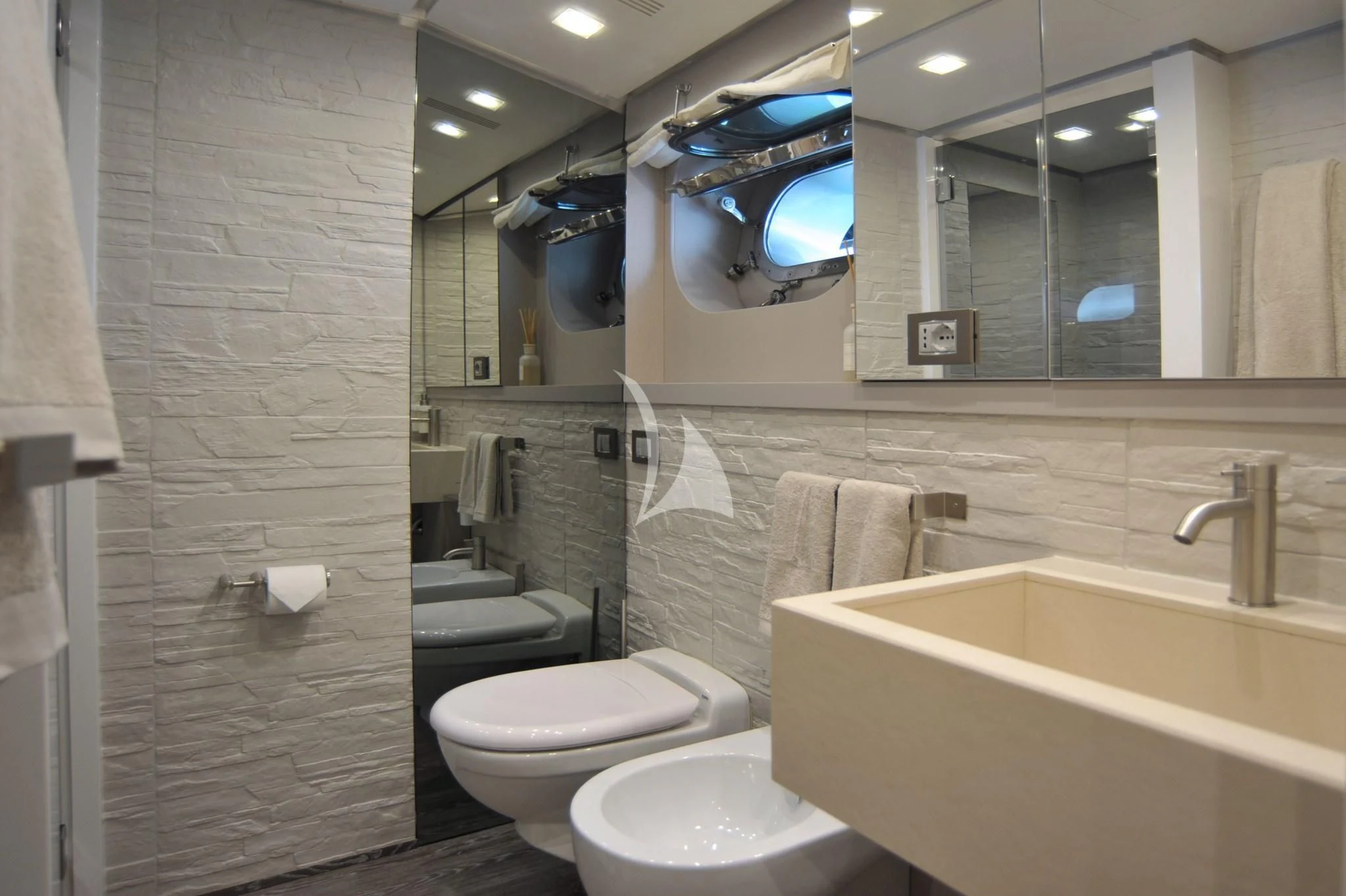 a bathroom with a large mirror aboard IROCK Yacht for Sale