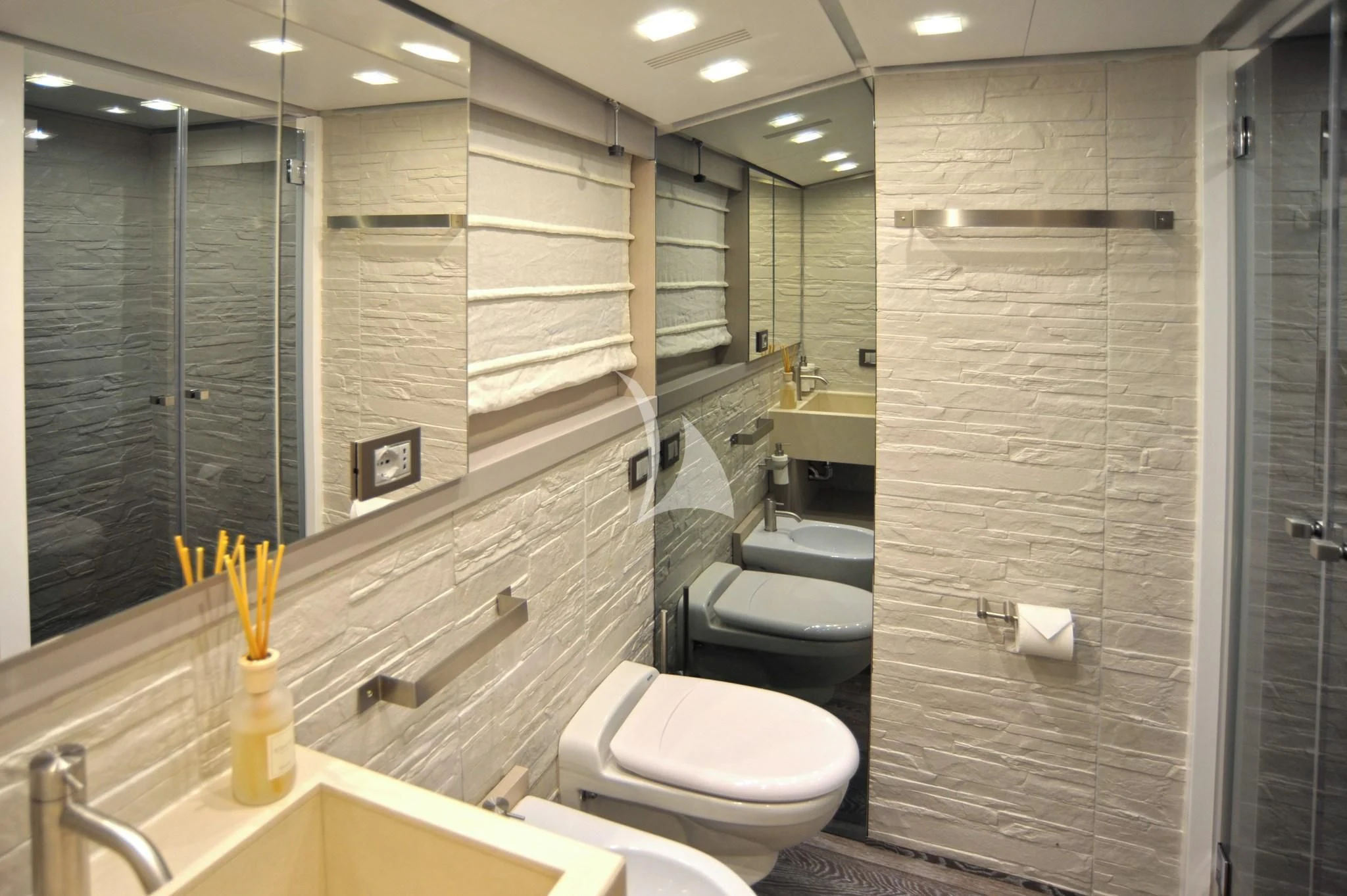 a bathroom with a glass shower aboard IROCK Yacht for Sale