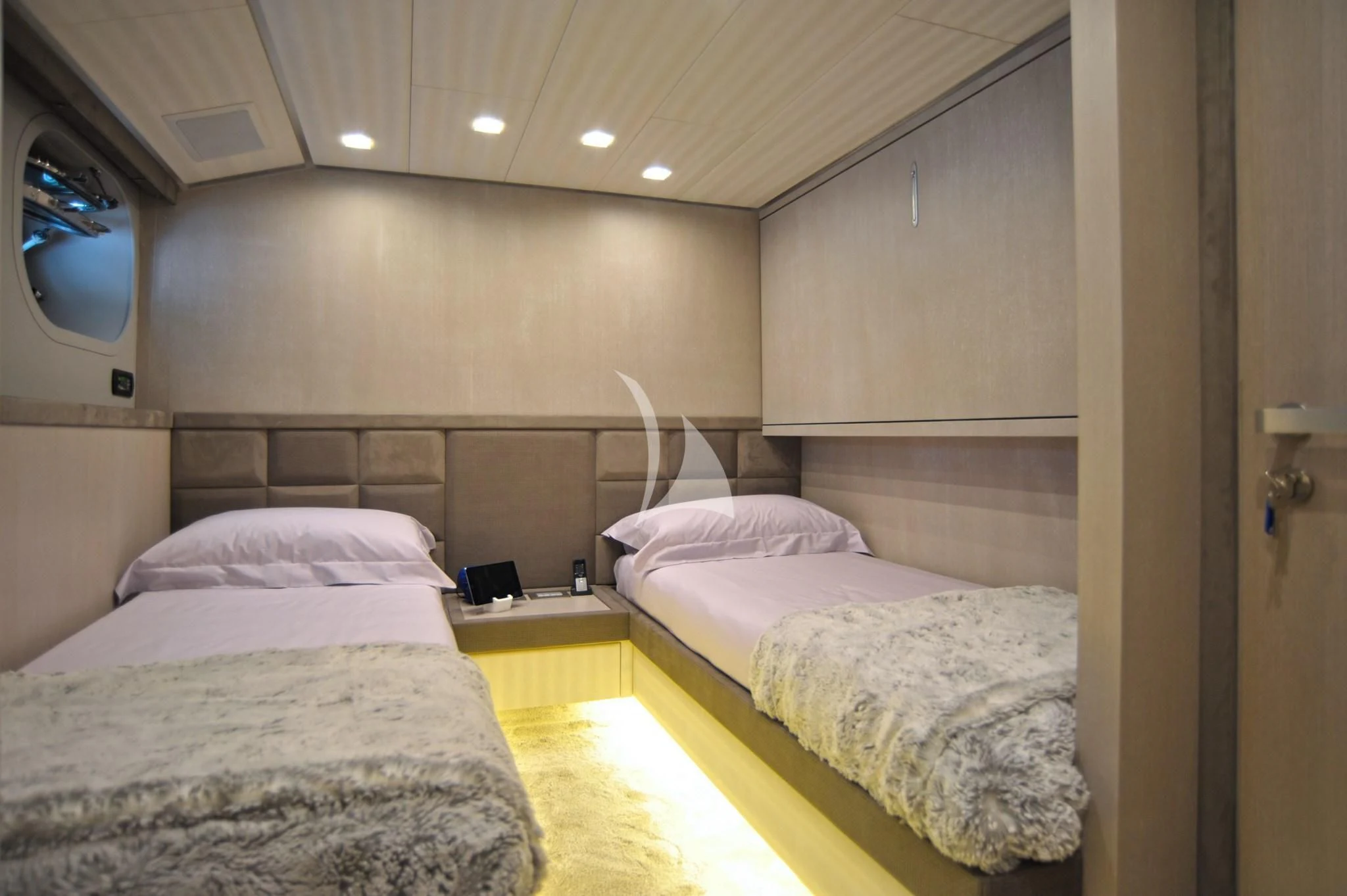 a room with two beds aboard IROCK Yacht for Sale