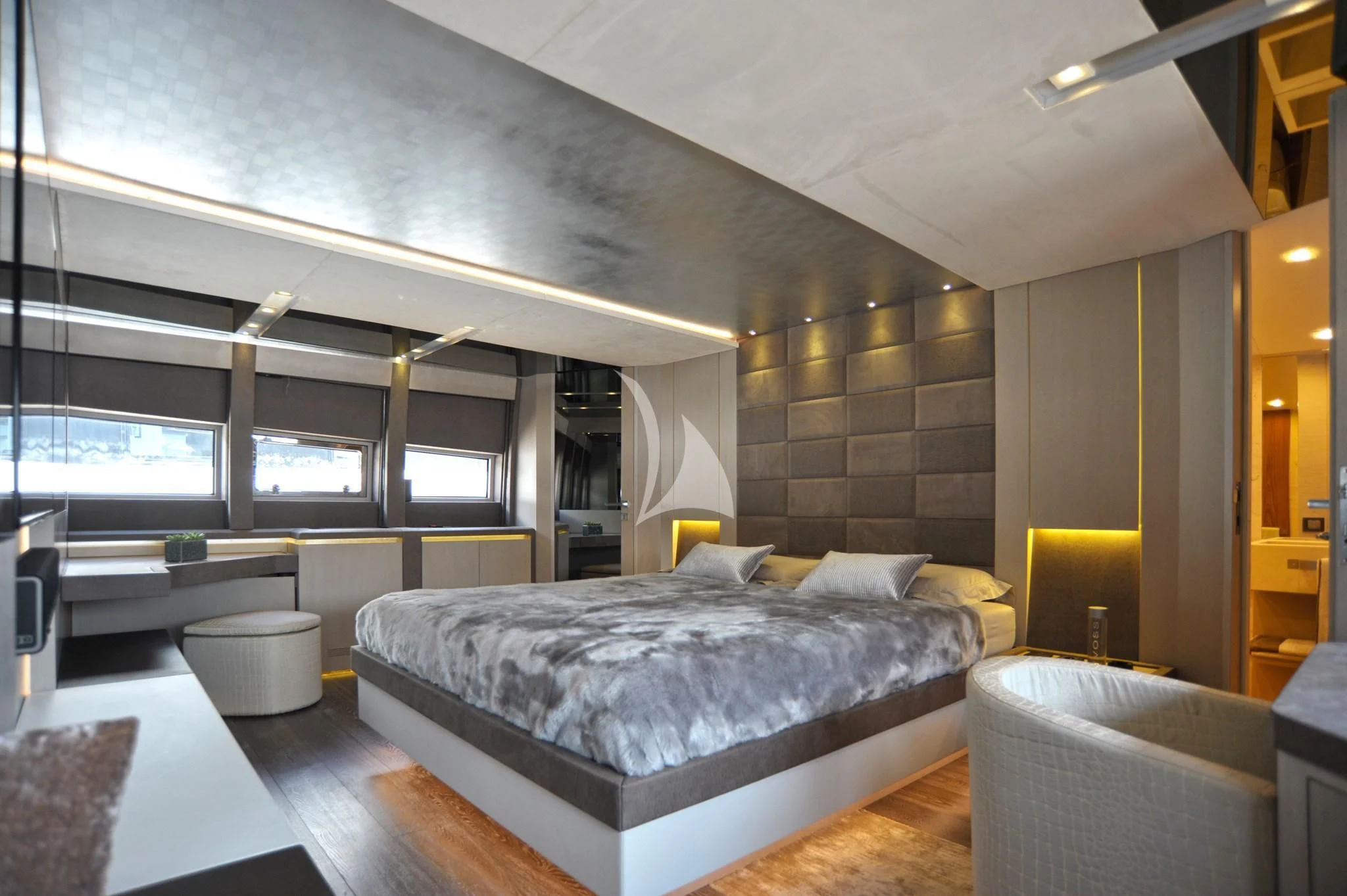 a large bedroom with a large bed aboard IROCK Yacht for Sale