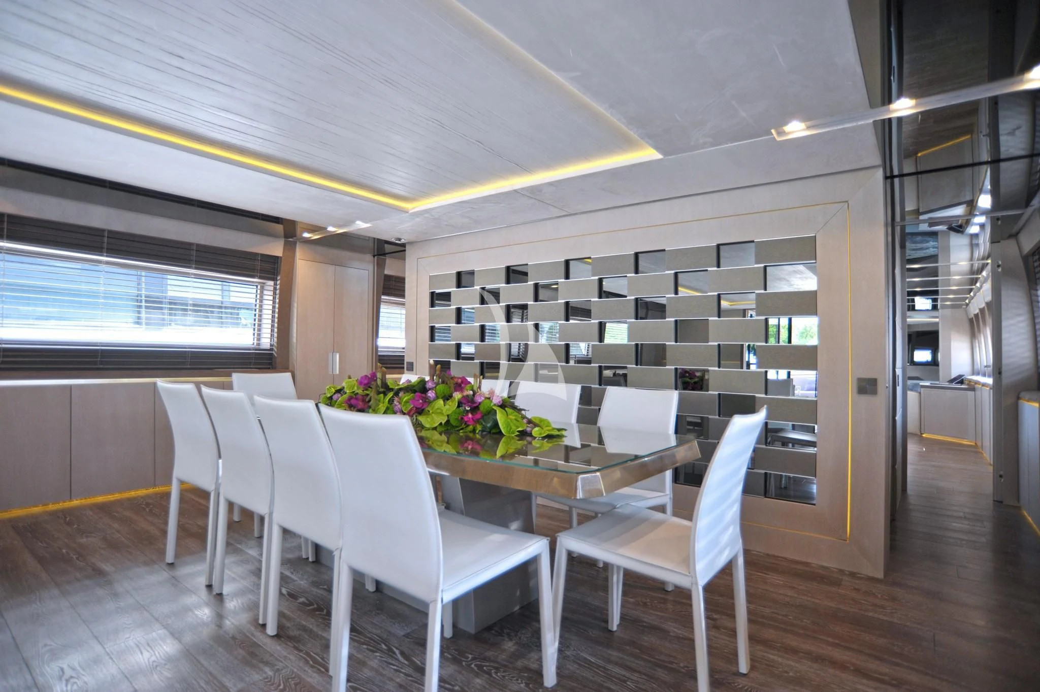 a room with a table chairs and a window aboard IROCK Yacht for Sale