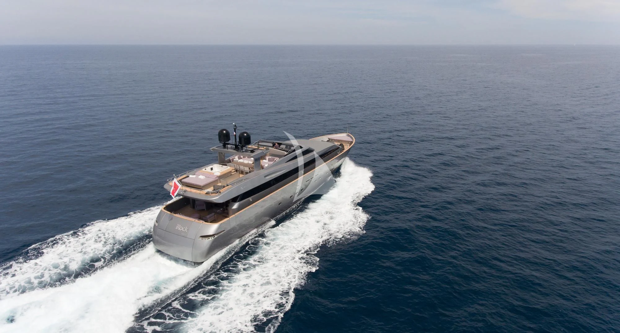 a military ship in the water aboard IROCK Yacht for Sale
