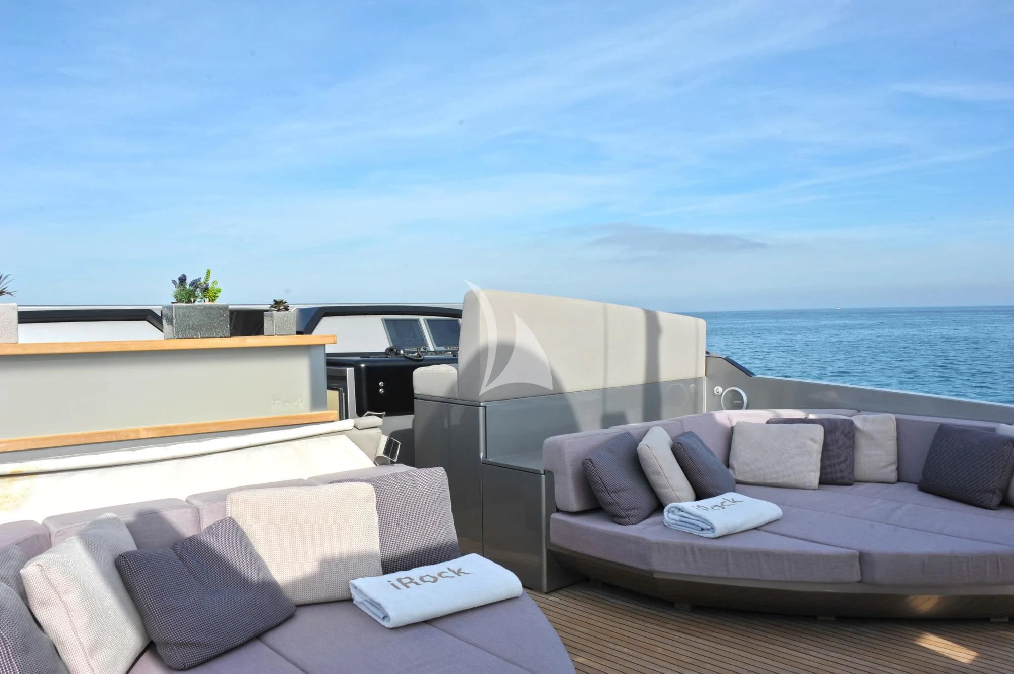a room with a couch and a table and a large body of water aboard IROCK Yacht for Sale