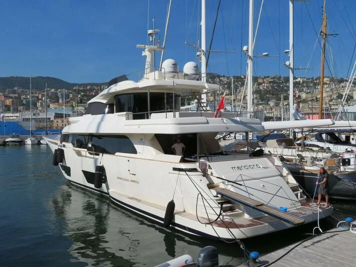 a boat docked at a pier aboard MERIDIANA Yacht for Sale