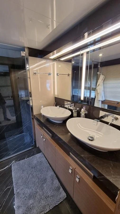 a bathroom with a sink and a mirror aboard MERIDIANA Yacht for Sale