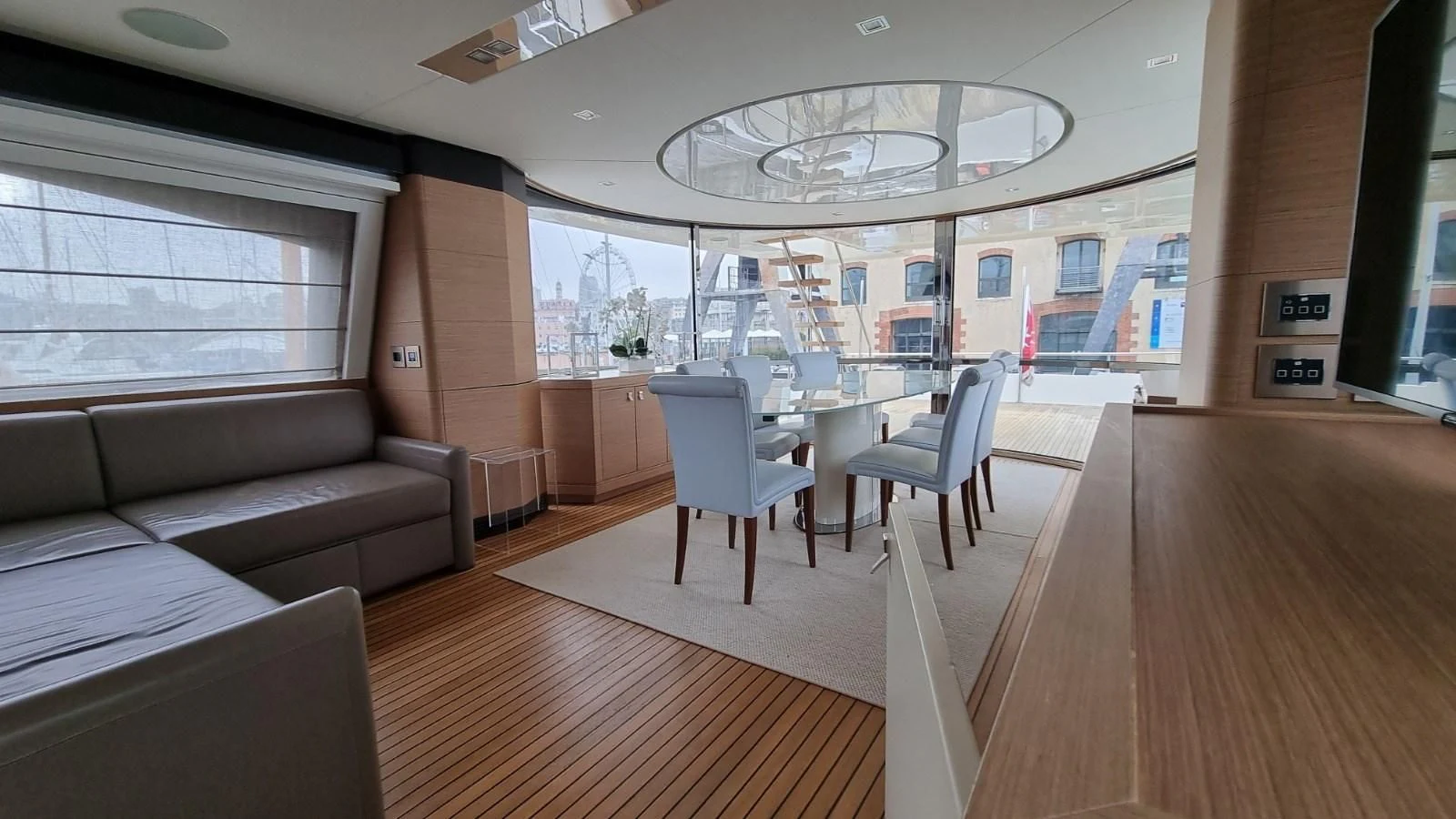 a room with a couch and a table and chairs aboard MERIDIANA Yacht for Sale