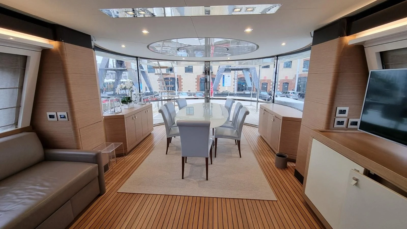 a room with a table and chairs aboard MERIDIANA Yacht for Sale
