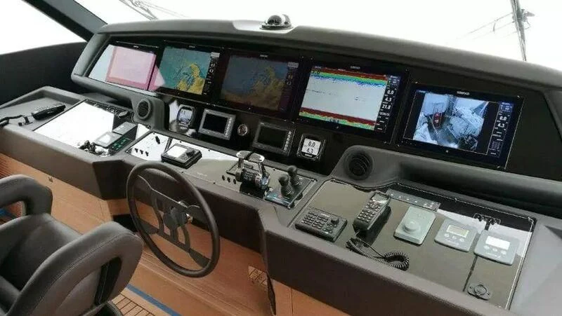 a desk with computers and other electronic devices on it aboard MERIDIANA Yacht for Sale