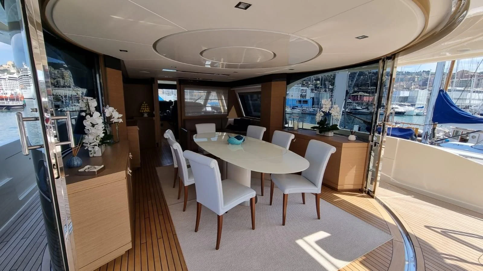 a room with a table and chairs aboard MERIDIANA Yacht for Sale