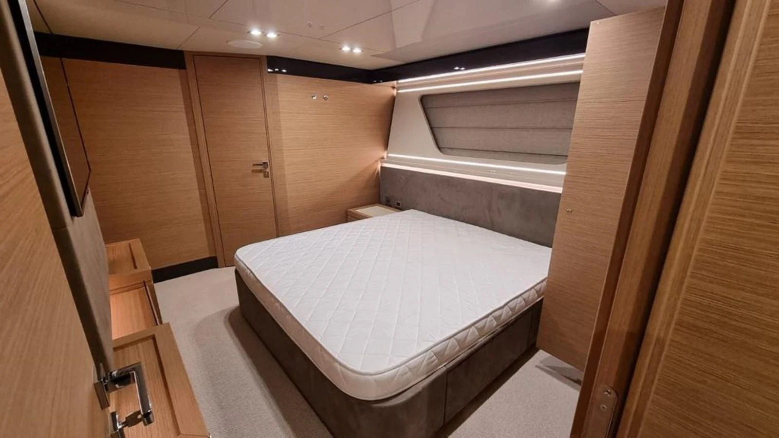 a room with a bed and a closet aboard MERIDIANA Yacht for Sale