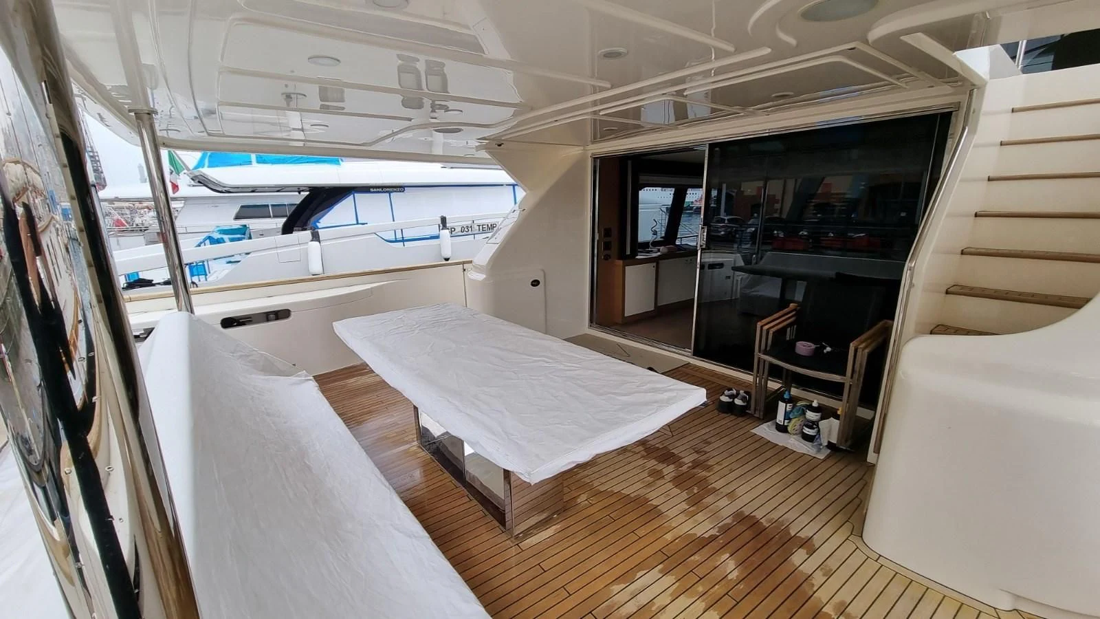 a room with a bed and a table aboard MERIDIANA Yacht for Sale