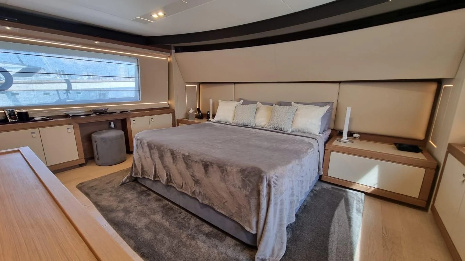 a bedroom with a bed and a desk aboard MERIDIANA Yacht for Sale