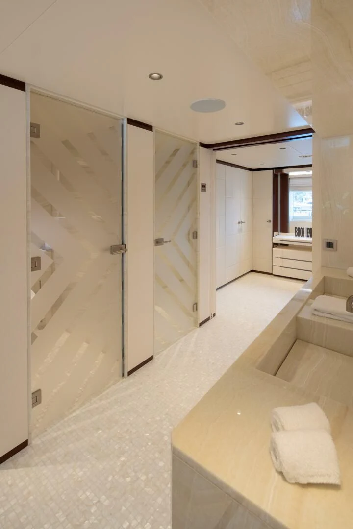 a bathroom with a large mirror aboard INFINITY Yacht for Sale