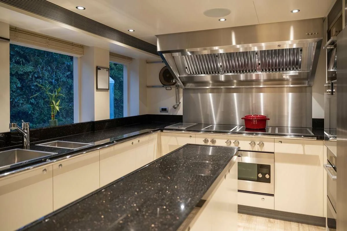 a kitchen with stainless steel appliances aboard INFINITY Yacht for Sale