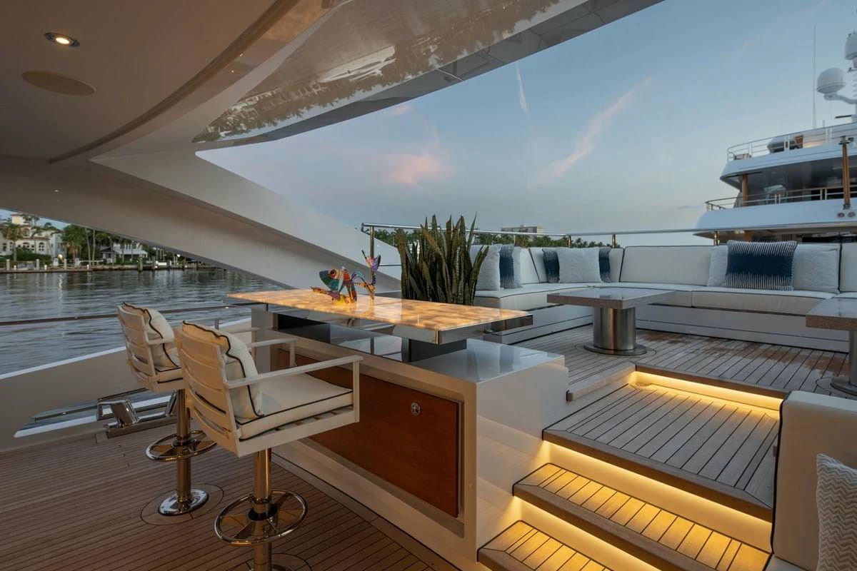 a room with a table and chairs aboard INFINITY Yacht for Sale