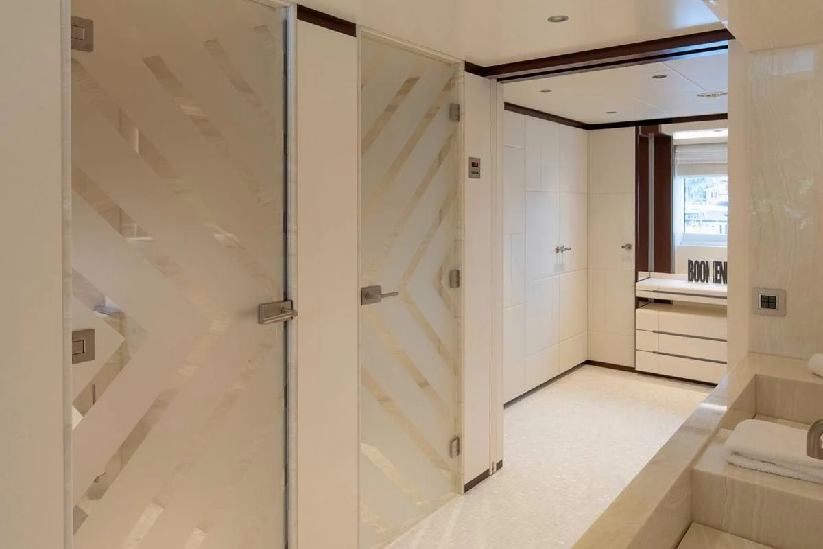 a hallway with a glass door aboard INFINITY Yacht for Sale
