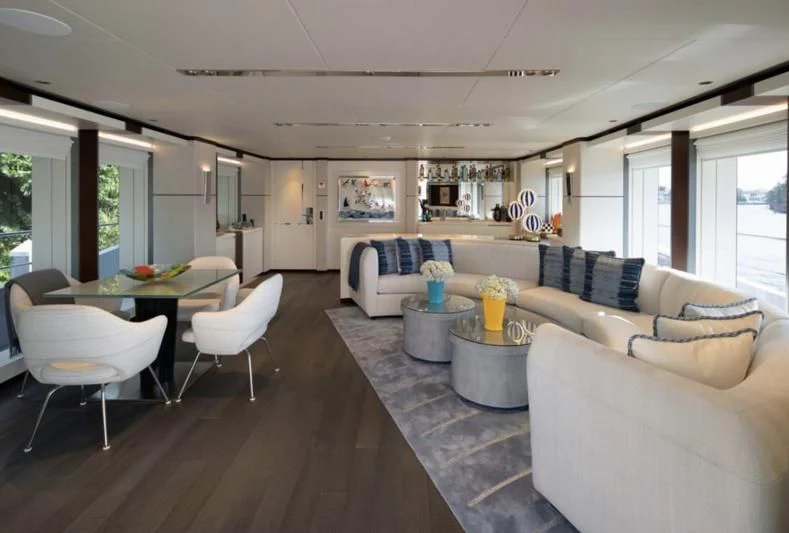a living room with a table and chairs aboard INFINITY Yacht for Sale