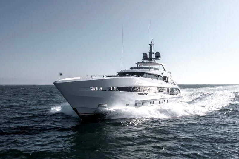 a white yacht in the water aboard INFINITY Yacht for Sale