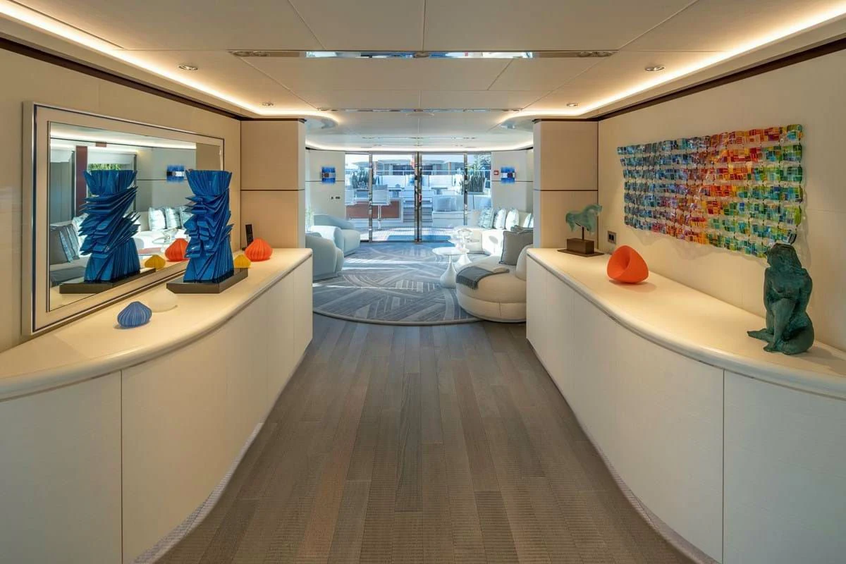 a room with a wood floor and a large mirror aboard INFINITY Yacht for Sale