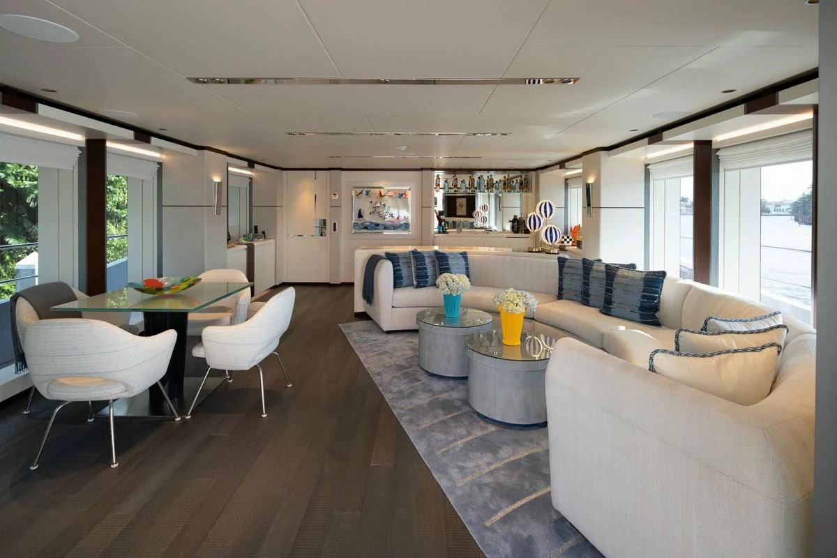a living room with a table and chairs aboard INFINITY Yacht for Sale