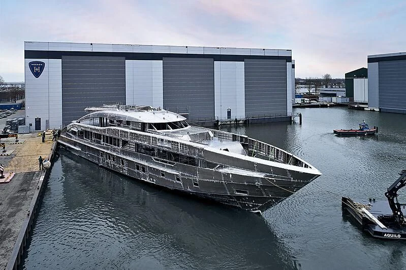 a large white boat in a body of water aboard INFINITY Yacht for Sale