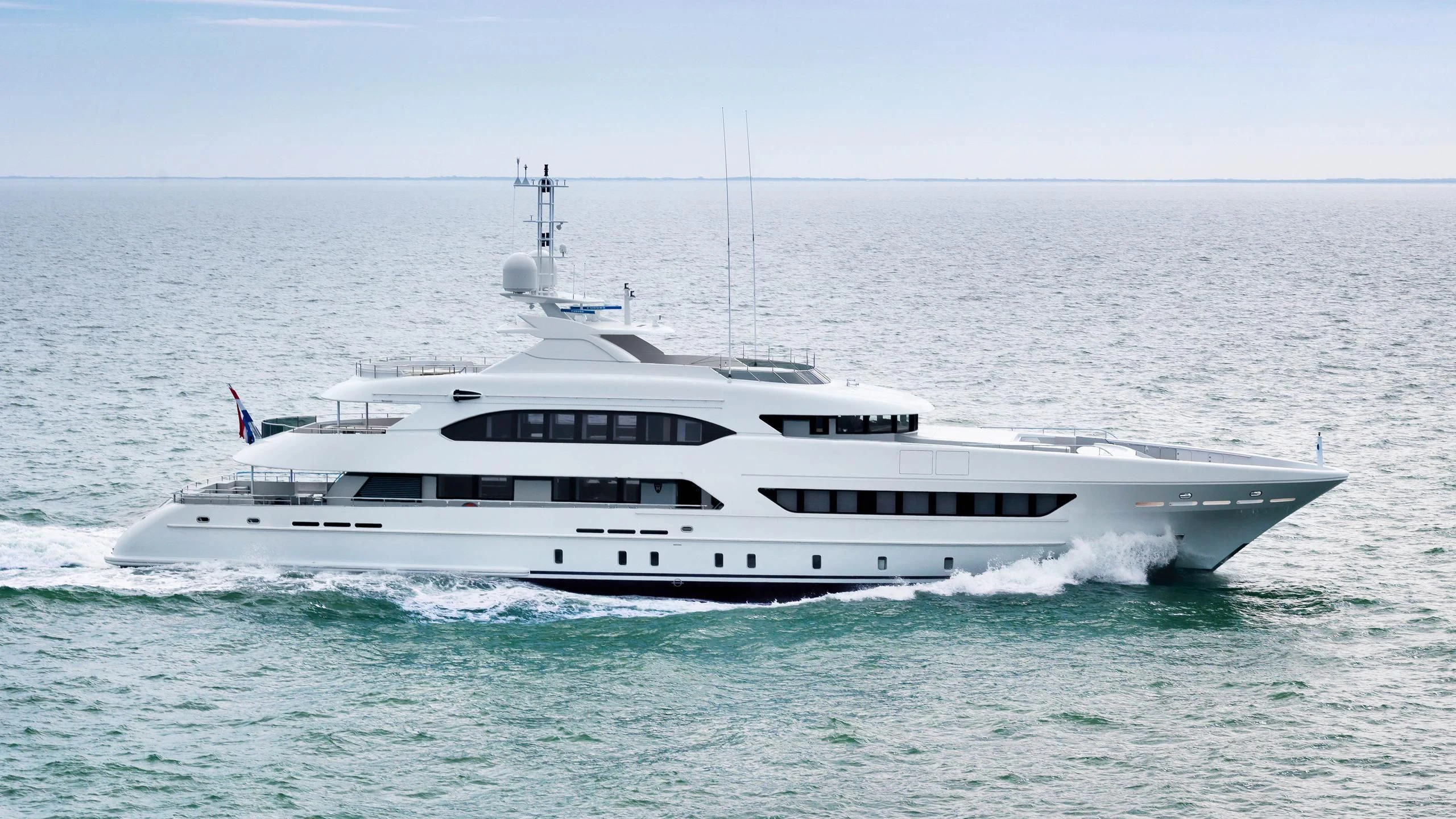 a white yacht in the ocean aboard INFINITY Yacht for Sale