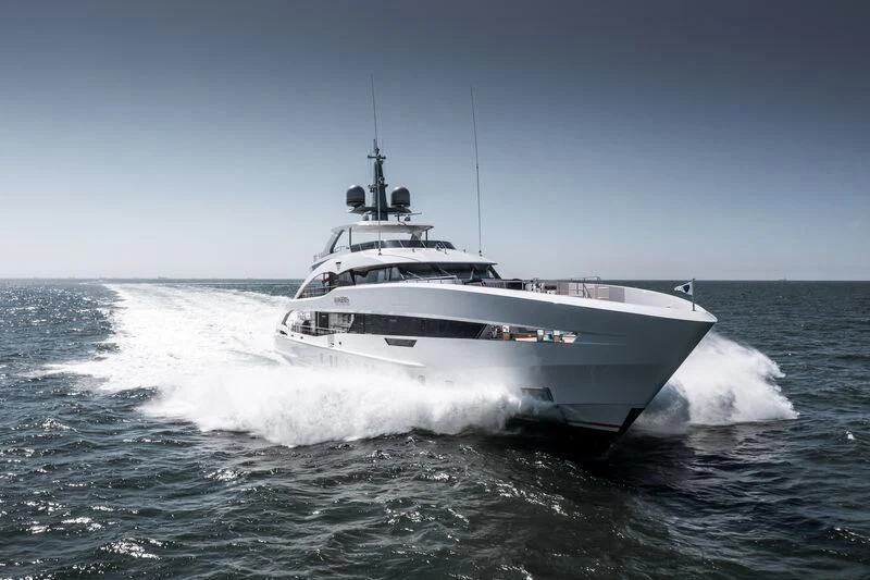 a white yacht on the water aboard INFINITY Yacht for Sale