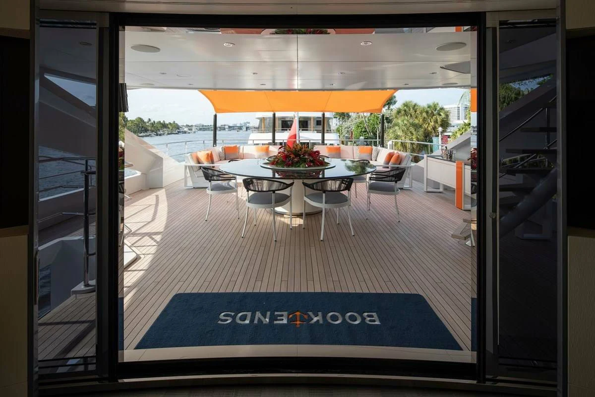 a room with a table and chairs aboard INFINITY Yacht for Sale
