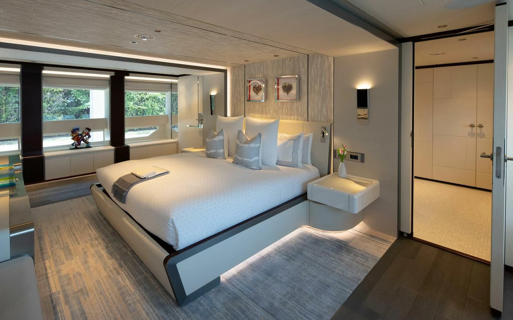 a large bedroom with a large bed aboard INFINITY Yacht for Sale