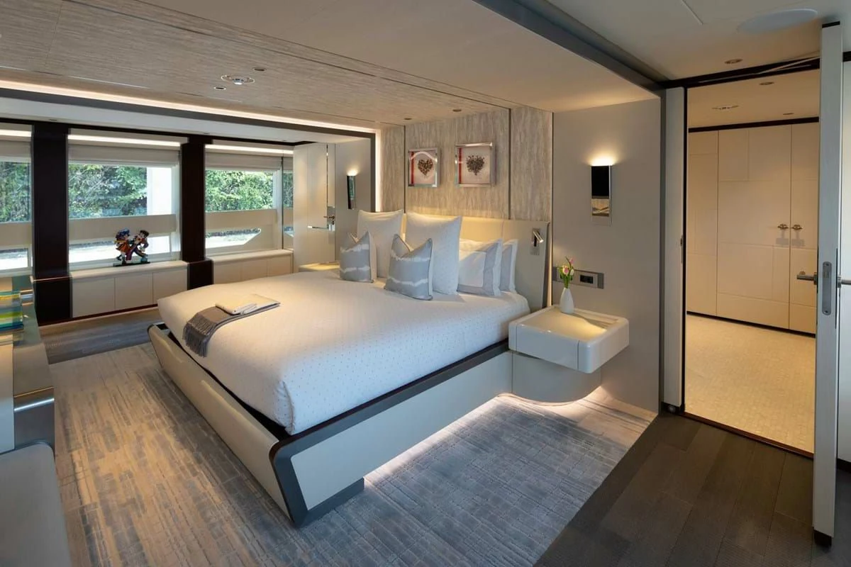 a large bedroom with a large bed aboard INFINITY Yacht for Sale